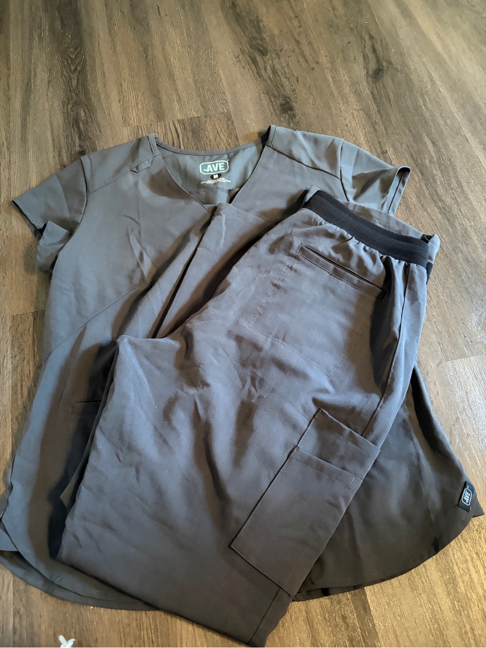grey medical scrubs from the brand AVE